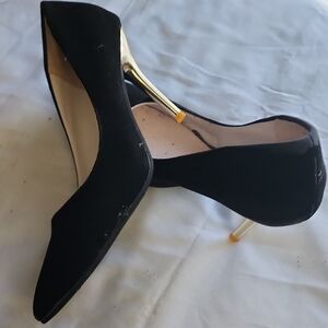 Elegant Black Pointed-Toe Heels with Gold Stiletto